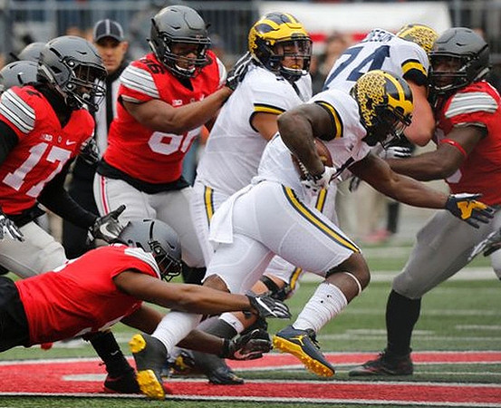 Mason Cole (52), De'Veon Smith (4), and Ben Bredeson (74)