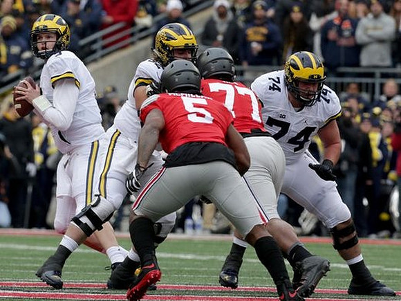 Wilton Speight (3), Mason Cole (52), and Ben Bredeson (74)