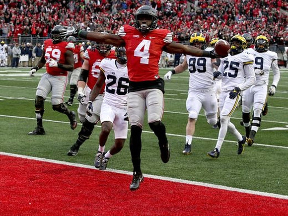 Jourdan Lewis (26), Matthew Godin (99), Dymonte Thomas (25), and Mike McCray (9)