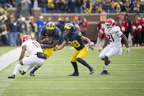 Tyrone Wheatley Jr. (17) and Grant Perry (88)