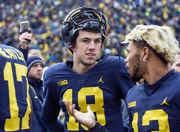 Tyrone Wheatley Jr. (17), Brandon Peters (18), and Eddie McDoom (13)