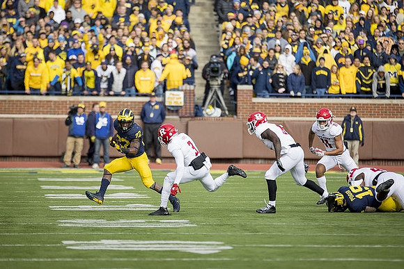 Karan Higdon (22) and Henry Poggi (19)