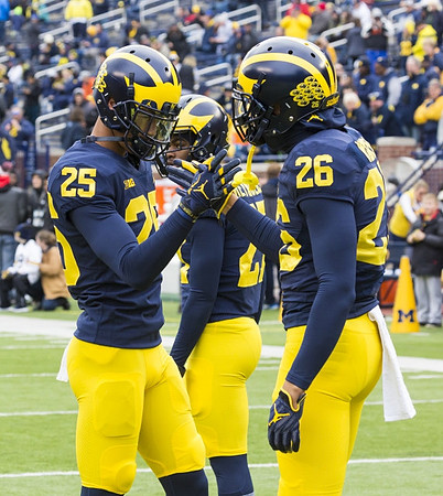 Benjamin St-Juste (25) and J'Marick Woods (26)