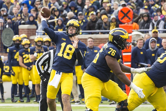Brandon Peters (18) and Juwann Bushell-Beatty (76)
