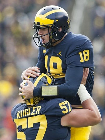 Patrick Kugler (57) and Brandon Peters (18)