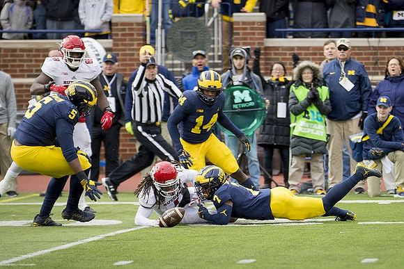 Aubrey Solomon (5), Josh Metellus (14), and Khaleke Hudson (7)