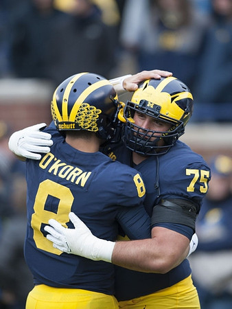 John O'Korn (8) and Jon Runyan Jr. (75)