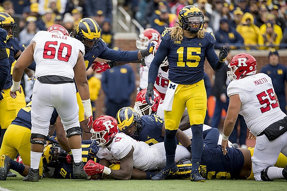 Devin Bush (10), Maurice Hurst (73), and Chase Winovich (15)