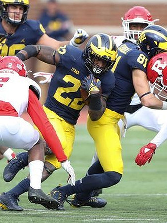 Karan Higdon (22) and Nate Schoenle (81)