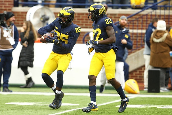Maurice Ways (85) and Karan Higdon (22)