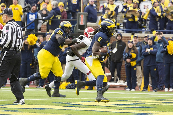 Michael Onwenu (50) and Kareem Walker (6)