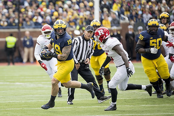 Henry Poggi (19) and Michael Onwenu (50)