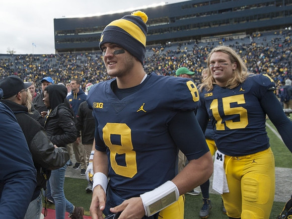 John O'Korn (8) and Chase Winovich (15)
