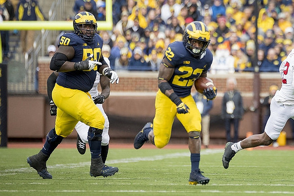 Michael Onwenu (50) and Karan Higdon (22)
