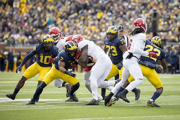 Devin Bush (10), Khaleke Hudson (7), Maurice Hurst (73), and David Long (22)