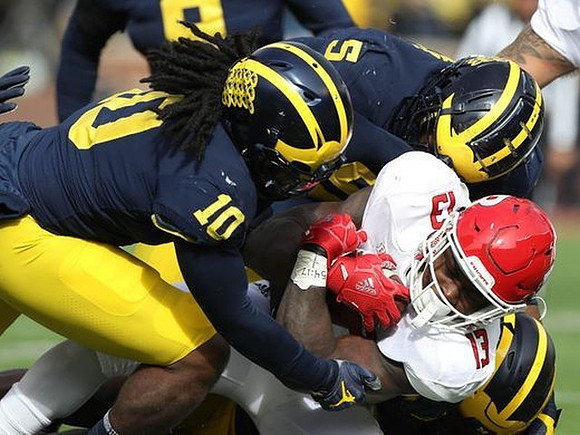 Devin Bush (10) and Aubrey Solomon (5)