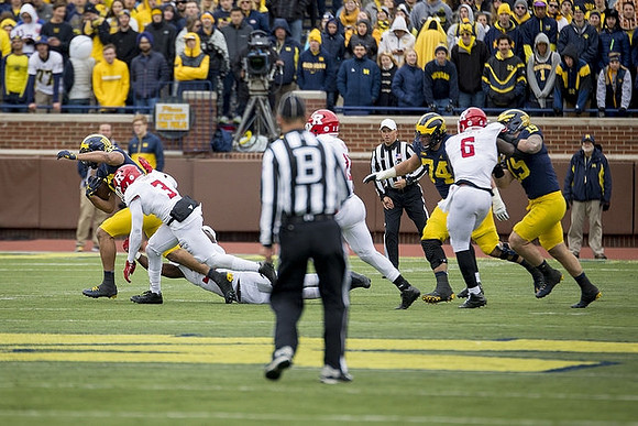 Ty Isaac (32), Ben Bredeson (74), and Henry Poggi (19)