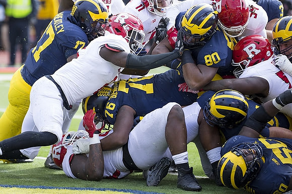 Tyrone Wheatley Jr. (17), Juwann Bushell-Beatty (76), Khalid Hill (80), and Michael Onwenu (50)