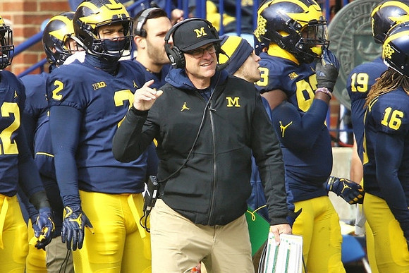 Carlo Kemp (2), Jim Harbaugh, and Lawrence Marshall (93)