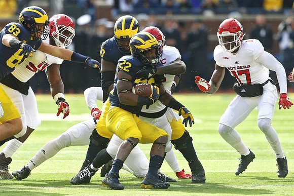 Zach Gentry (83), Khalid Hill (80), and Karan Higdon (22)