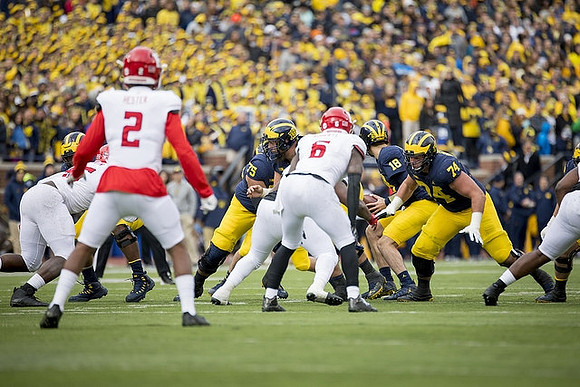 Jon Runyan Jr. (75), Brandon Peters (18), and Ben Bredeson (74)