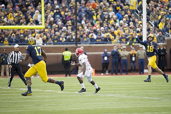 Tyrone Wheatley Jr. (17) and Brandon Peters (18)