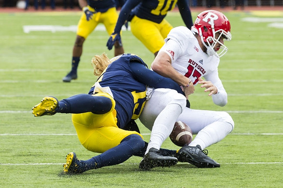 Chase Winovich (15) and Devin Bush (10)