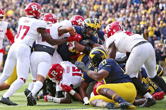 Tyrone Wheatley Jr. (17), Khalid Hill (80), and Michael Onwenu (50)