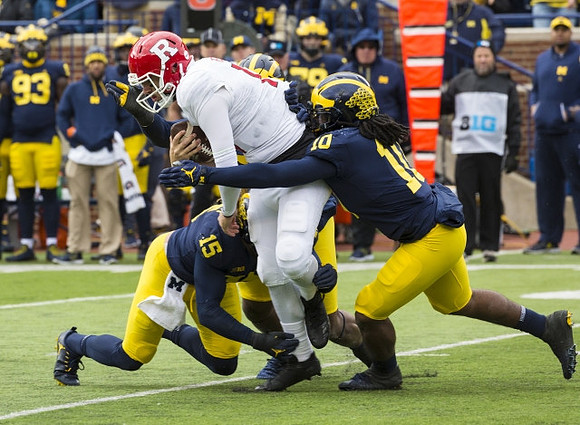 Chase Winovich (15) and Devin Bush (10)