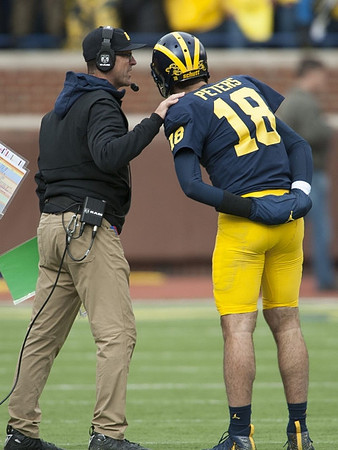 Jim Harbaugh and Brandon Peters (18)