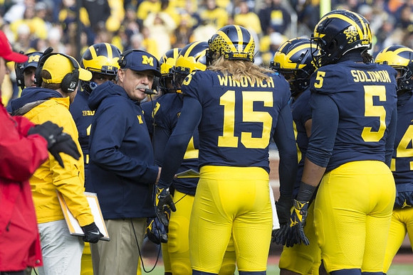 Don Brown, Chase Winovich (15), and Aubrey Solomon (5)
