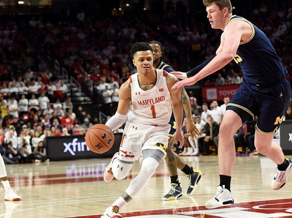 Zavier Simpson (3) and Jon Teske (15)