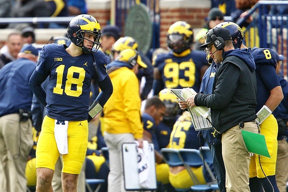 Brandon Peters (18), John O'Korn (8), and Jim Harbaugh