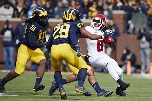 Devin Bush (10), Rashan Gary (3), and Brandon Watson (28)