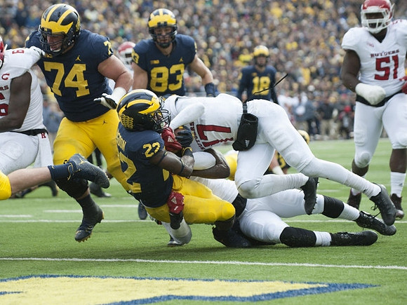 Ben Bredeson (74), Karan Higdon (22), Zach Gentry (83), and Brandon Peters (18)