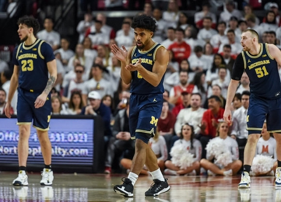 Brandon Johns Jr. (23), David DeJulius (0), and Austin Davis (51)