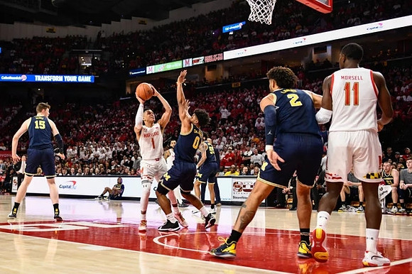 Jon Teske (15), David DeJulius (0), Eli Brooks (55), and Isaiah Livers (2)