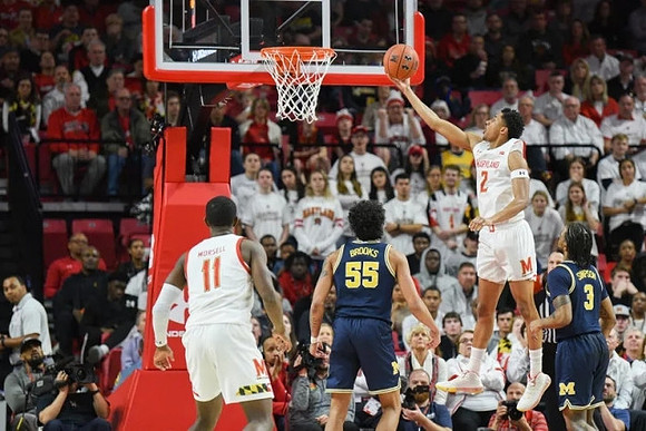 Eli Brooks (55) and Zavier Simpson (3)