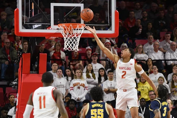 Eli Brooks (55) and Zavier Simpson (3)