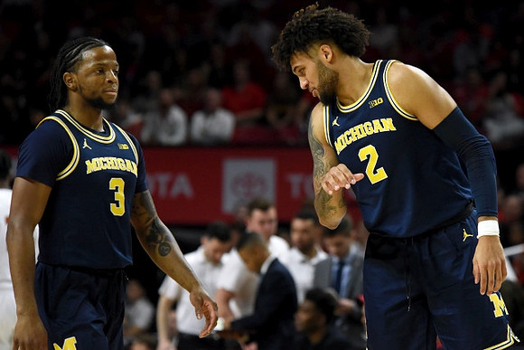 Zavier Simpson (3) and Isaiah Livers (2)