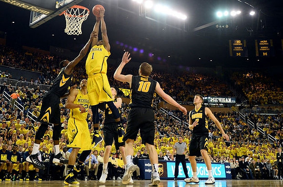 Glenn Robinson III (1) and Jordan Morgan (52)