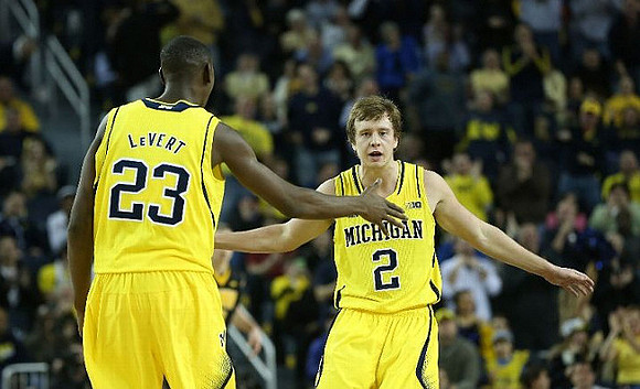 Caris LeVert (23) and Spike Albrecht (2)