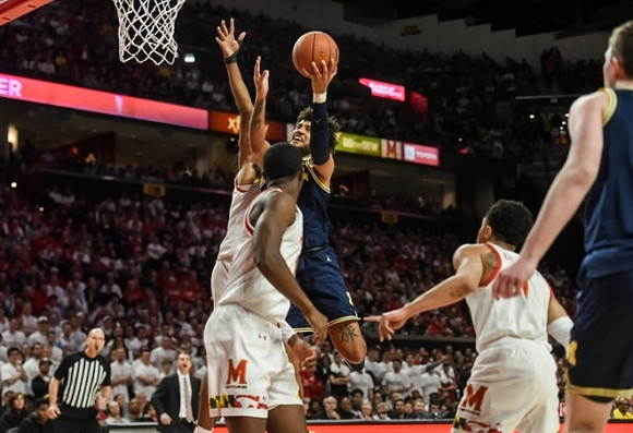 Isaiah Livers (2) and Jon Teske (15)