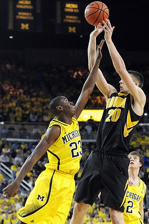 Caris LeVert (23) and Spike Albrecht (2)