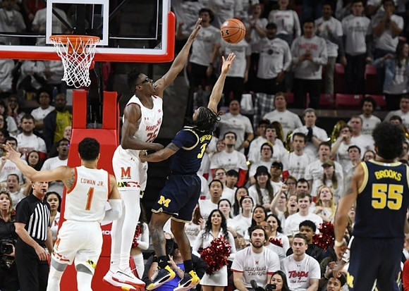 Zavier Simpson (3) and Eli Brooks (55)