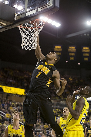 Spike Albrecht (2), Jordan Morgan (52), and Caris LeVert (23)