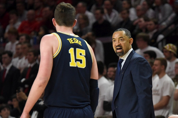 Jon Teske (15) and Juwan Howard