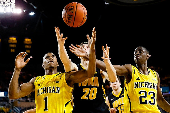 Glenn Robinson III (1) and Caris LeVert (23)