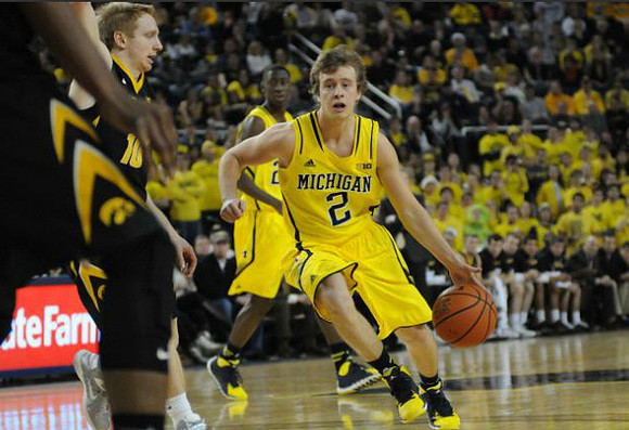 Spike Albrecht (2) and Caris LeVert (23)