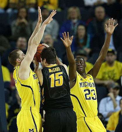 Nik Stauskas (11) and Caris LeVert (23)